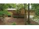 Wood and stone exterior of house with a sloped front yard and attached two car garage at 3852 Vinyard Ne Ct, Marietta, GA 30062