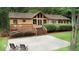 Home exterior featuring a spacious deck, landscaped yard, and outdoor seating area at 3852 Vinyard Ne Ct, Marietta, GA 30062