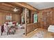 Inviting living room with wood paneled walls, a stone fireplace, and a cozy seating area at 3852 Vinyard Ne Ct, Marietta, GA 30062