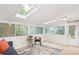 Bright sun room with skylights, a cozy sitting area, and nature views at 3852 Vinyard Ne Ct, Marietta, GA 30062