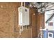 View of the installed wall-mounted tankless water heater in the home's utility area at 3852 Vinyard Ne Ct, Marietta, GA 30062