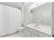 Clean bathroom with a white vanity, toilet, and a shower with a white curtain at 4477 Village Dr, Atlanta, GA 30338