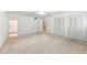 Large bedroom featuring neutral carpet, large closet, and bathroom access at 4477 Village Dr, Atlanta, GA 30338