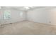 Bright and airy bedroom with neutral carpet and windows with white shutters at 4477 Village Dr, Atlanta, GA 30338