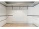 Spacious walk-in closet with built-in shelving and ample storage space at 4477 Village Dr, Atlanta, GA 30338