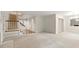 Bright living room featuring a staircase with a light-filled foyer and an open space for entertaining at 4477 Village Dr, Atlanta, GA 30338