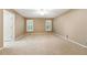Large main bedroom featuring carpet flooring, neutral walls, and ample space for furniture arrangement at 4477 Village Dr, Atlanta, GA 30338