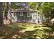 Rear exterior view of home showing green siding, white trim, and a well-maintained lawn at 720 Maynard Se Ter, Atlanta, GA 30316