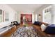 Spacious living room flowing into the dining area, with hardwood floors and a stylish rug at 720 Maynard Se Ter, Atlanta, GA 30316