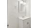 White bathroom vanity with a sink, mirror, and cabinet at 1365 Athens Sw Ave, Atlanta, GA 30310