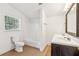 Clean bathroom with tile floor, tub and shower combo, and neutral decor at 1365 Athens Sw Ave, Atlanta, GA 30310