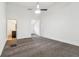 Spacious bedroom featuring carpet, ceiling fan, and a view to an en-suite bathroom at 1365 Athens Sw Ave, Atlanta, GA 30310