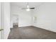 Well-lit bedroom featuring neutral walls, carpet, and views to en-suite bathroom at 1365 Athens Sw Ave, Atlanta, GA 30310
