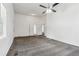 Open living space featuring a ceiling fan, new carpet, and natural light at 1365 Athens Sw Ave, Atlanta, GA 30310