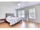 Bright bedroom with hardwood floors and natural light at 306 Autumn Leaf Way, Norcross, GA 30093