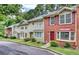 Inviting townhome with manicured lawns and colorful landscaping features at 306 Autumn Leaf Way, Norcross, GA 30093