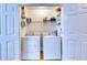 Convenient laundry room featuring updated washer and dryer, and plenty of storage at 306 Autumn Leaf Way, Norcross, GA 30093