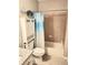 Cozy bathroom with a tub, decorative shower curtain, and a built-in storage unit at 3473 Newtons Crest Cir, Snellville, GA 30078