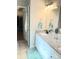 Modern bathroom featuring a granite-topped vanity and walk-in closet access at 3473 Newtons Crest Cir, Snellville, GA 30078