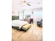 Bright bedroom with hardwood flooring, large windows, and stylish furnishings at 3473 Newtons Crest Cir, Snellville, GA 30078