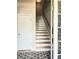 Inviting entryway with staircase and patterned rug; a classic design for a warm welcome at 3473 Newtons Crest Cir, Snellville, GA 30078