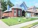 A landscaped yard surrounds this charming two-story home with manicured lawn at 3473 Newtons Crest Cir, Snellville, GA 30078
