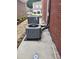 Exterior shot of two AC units on a paved surface near the brick exterior at 3473 Newtons Crest Cir, Snellville, GA 30078