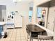Open kitchen with ceramic tile flooring and view to front entryway at 3473 Newtons Crest Cir, Snellville, GA 30078