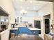 Bright kitchen with stainless steel appliances, blue island, and modern finishes, offering ample space at 3473 Newtons Crest Cir, Snellville, GA 30078