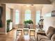 Bright and inviting living room boasts ample natural light, hardwood floors, and neutral decor at 3473 Newtons Crest Cir, Snellville, GA 30078