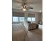 Comfortable bedroom with a queen-size bed, ceiling fan, and seating area at 3579 Silvery Way, Powder Springs, GA 30127