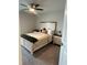 Bedroom with neutral walls, carpeted floor, ceiling fan and a bed with white wood trim at 3579 Silvery Way, Powder Springs, GA 30127