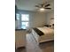 Bedroom with neutral walls, carpeted floor, ceiling fan and a bed with white wood trim at 3579 Silvery Way, Powder Springs, GA 30127