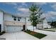 Attractive townhome with brick accents, showcasing a well-maintained facade and convenient garage access at 3579 Silvery Way, Powder Springs, GA 30127