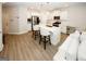 Modern kitchen with a large island, seating, stainless steel appliances, and an open layout to the living area at 3579 Silvery Way, Powder Springs, GA 30127