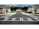 Street view of the neighborhood with well-manicured lawns and sidewalks at 3579 Silvery Way, Powder Springs, GA 30127