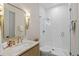Bathroom featuring a glass shower, stone vanity, and brass fixtures at 1433 Wessyngton Ne Rd, Atlanta, GA 30306
