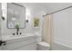 Clean bathroom with white walls, white cabinets, black fixtures, and shower with tub at 1433 Wessyngton Ne Rd, Atlanta, GA 30306