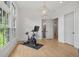 Bonus room with an exercise bike, hardwood floors, and natural light from large windows at 1433 Wessyngton Ne Rd, Atlanta, GA 30306