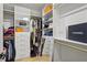 Organized closet featuring shelves, drawers, hanging rods, and designer fashion boxes at 1433 Wessyngton Ne Rd, Atlanta, GA 30306
