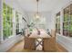 Charming dining room features large windows, wood floors and neutral decor at 1433 Wessyngton Ne Rd, Atlanta, GA 30306