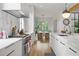 Bright kitchen with island, marble countertops, stainless steel appliances, and eat-in dining area at 1433 Wessyngton Ne Rd, Atlanta, GA 30306