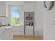 Bright kitchen pantry with shelves and drawers, featuring a microwave and beverage center at 1433 Wessyngton Ne Rd, Atlanta, GA 30306