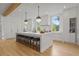 Modern kitchen features a large marble island and pendant lighting at 1433 Wessyngton Ne Rd, Atlanta, GA 30306