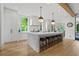 Spacious kitchen features a large island, pendant lighting, and modern appliances at 1433 Wessyngton Ne Rd, Atlanta, GA 30306