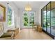 Living room with a view to the outside through oversized windows at 1433 Wessyngton Ne Rd, Atlanta, GA 30306