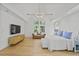 Large main bedroom with vaulted ceiling, hardwood floors, and ample natural light at 1433 Wessyngton Ne Rd, Atlanta, GA 30306