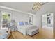 Bright main bedroom with hardwood floors and view to ensuite bathroom at 1433 Wessyngton Ne Rd, Atlanta, GA 30306