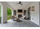 Covered patio featuring an outdoor fireplace and comfortable seating area at 1433 Wessyngton Ne Rd, Atlanta, GA 30306