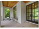 Charming porch view with cozy hanging chair, and brick detail at 1433 Wessyngton Ne Rd, Atlanta, GA 30306